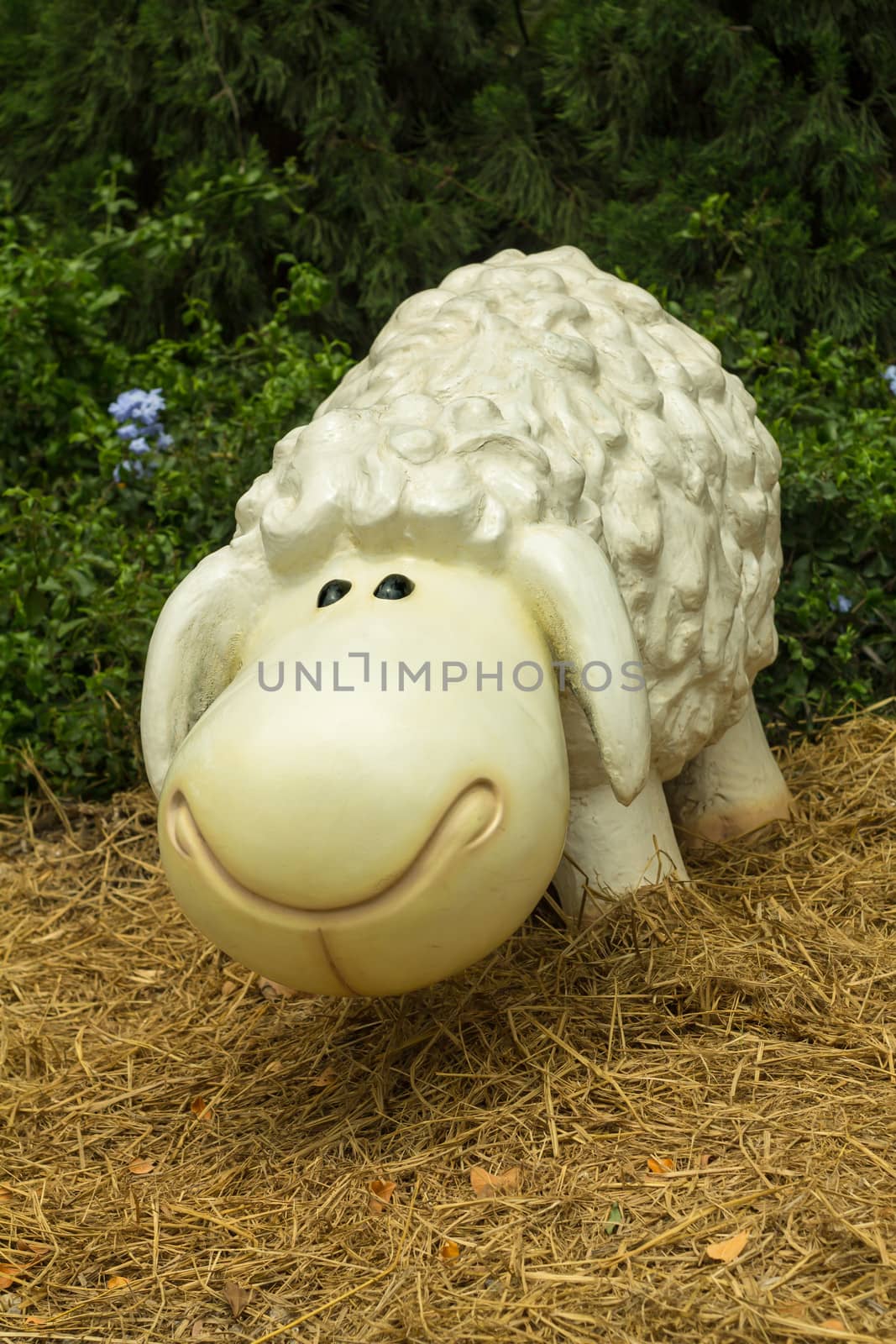 White Sheep Sculpture in garden.