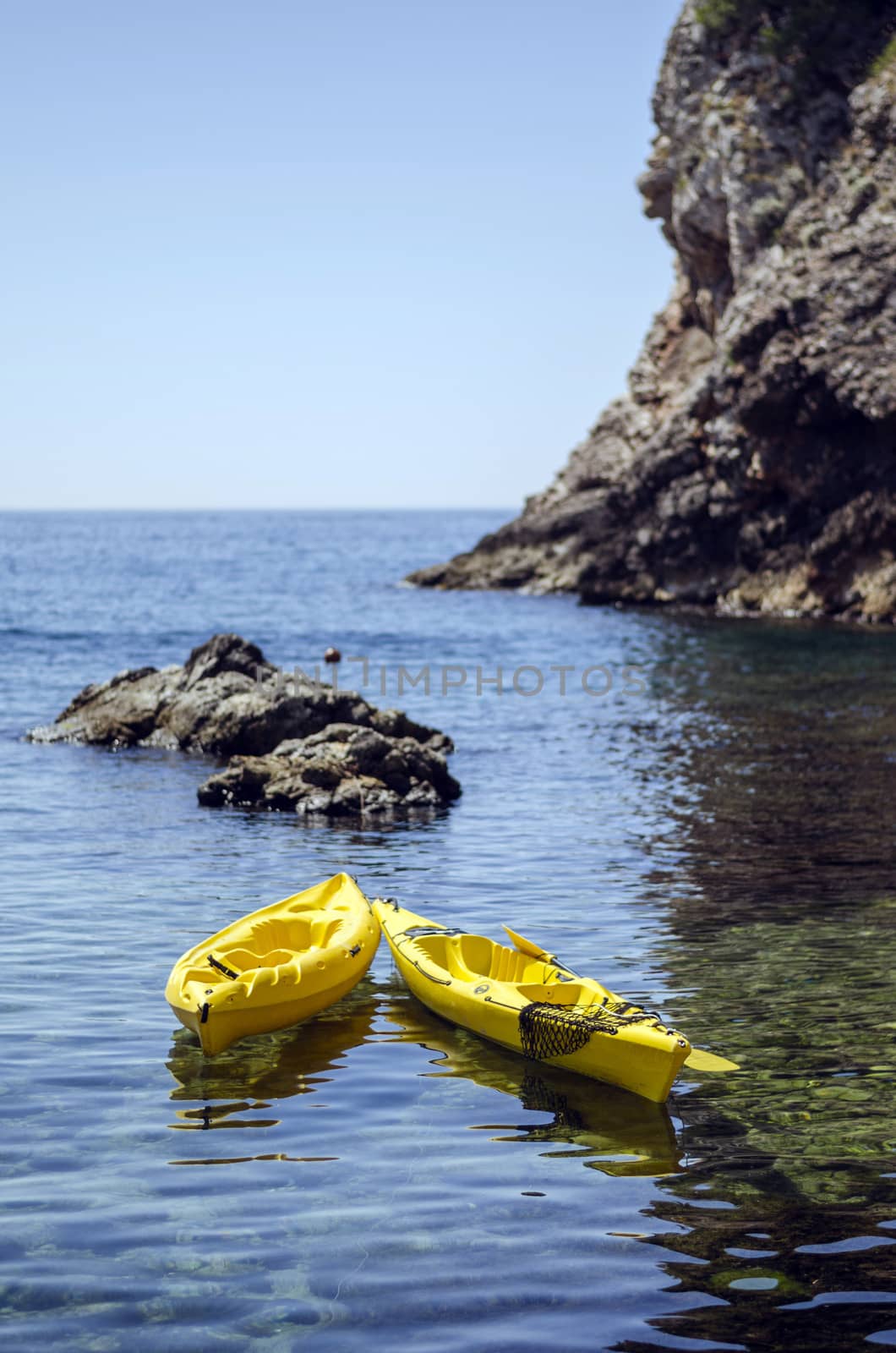 Pair of canoes at the cliffy seashore near Dubrovnik, Croatia.