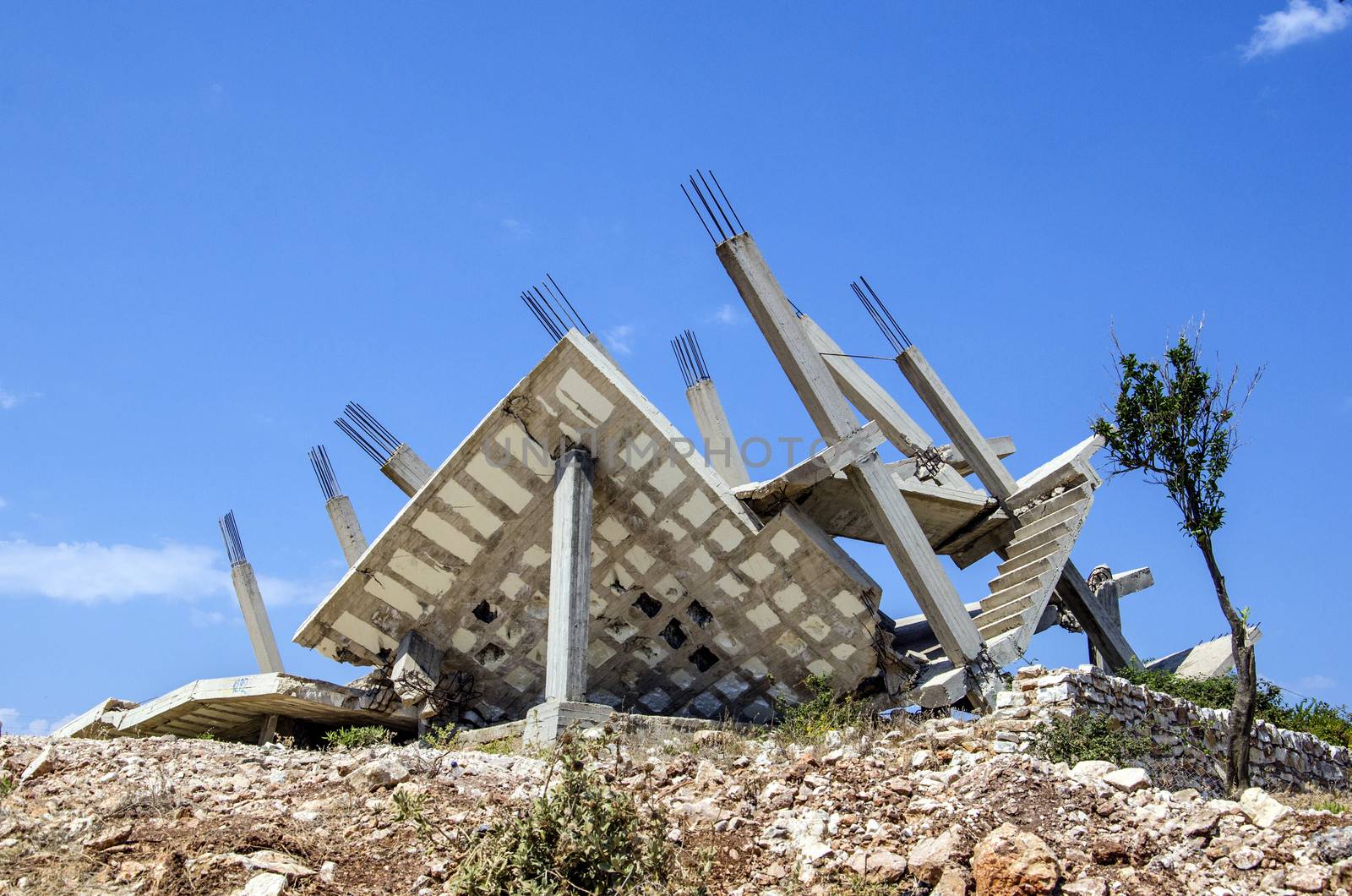 Collapsed construction because of bad construction planning with insufficient reinforcements, Ksamil, Albania.