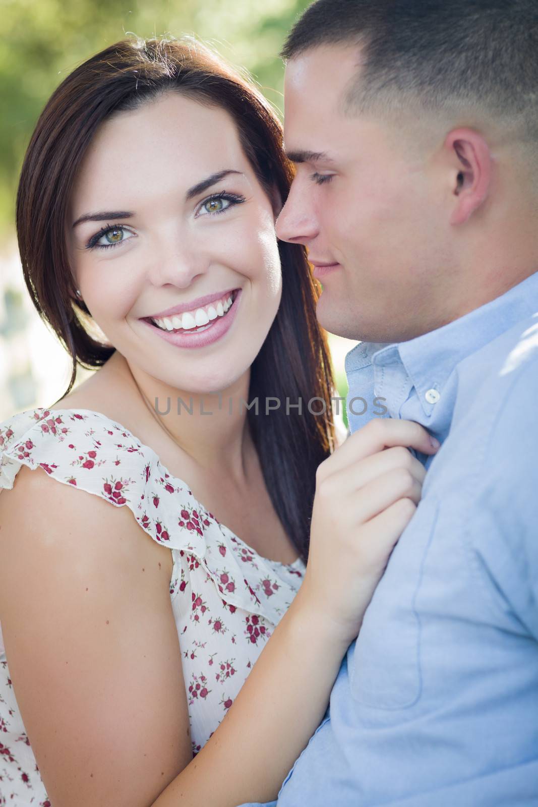 Happy Mixed Race Romantic Couple Portrait in the Park.