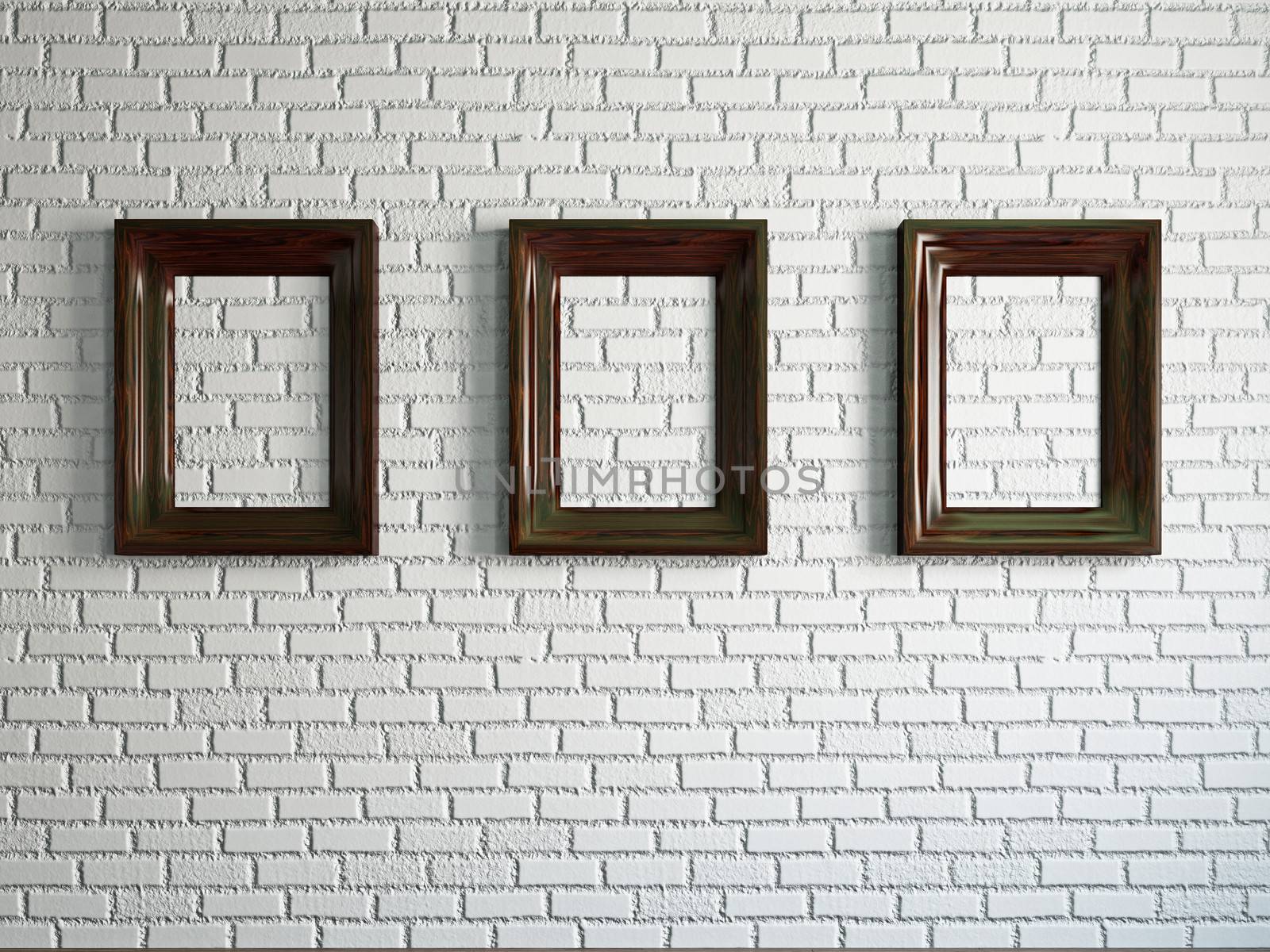 Three empty wooden frames on the brick wall