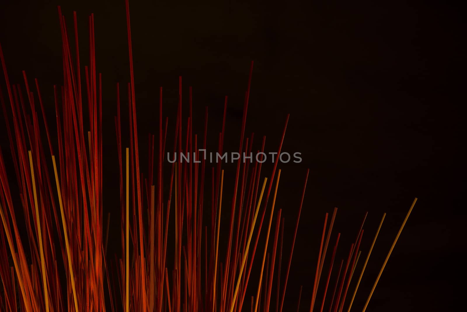 abstract background of red sticks at night