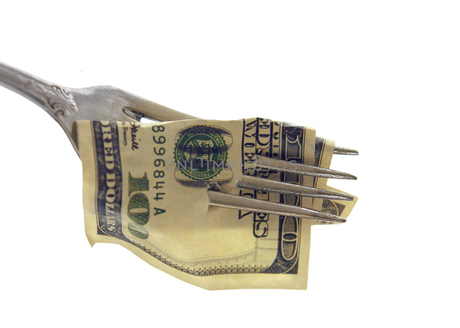 100 USA Dollars impaled on a fork - Isolated object on a white b by cococinema