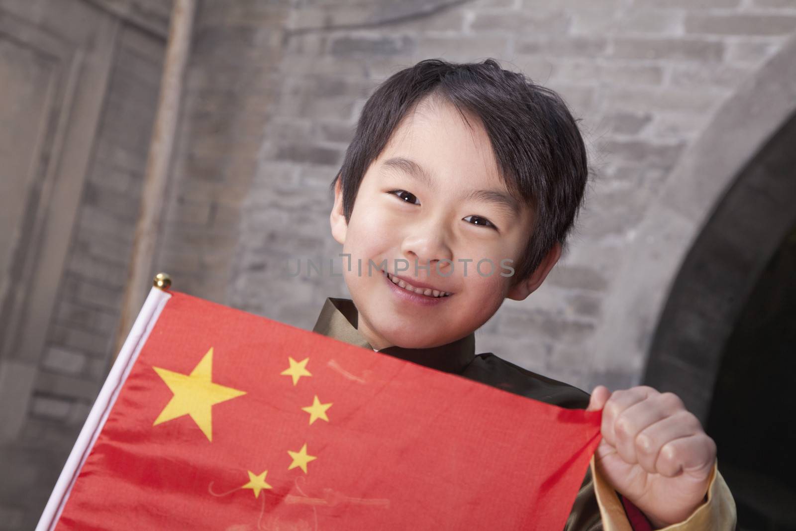 Young Boy in Traditional Courtyard with Chinese Flag