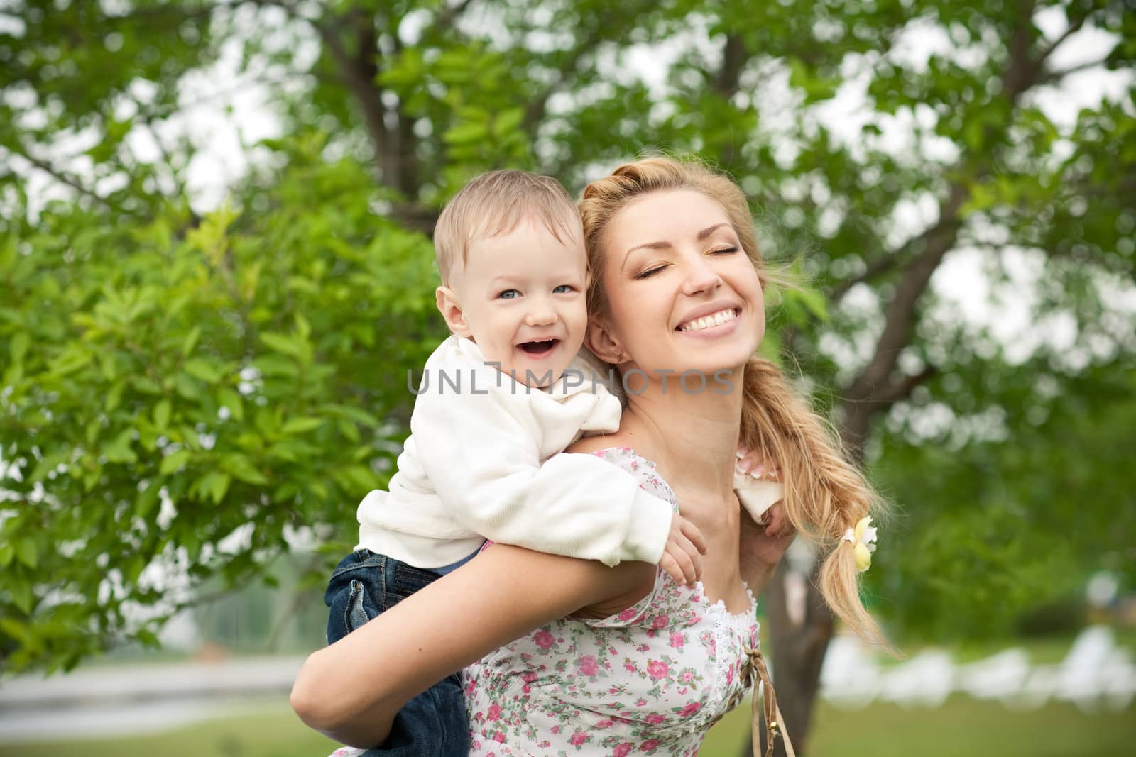 picture of happy baby with mother enjoying nature