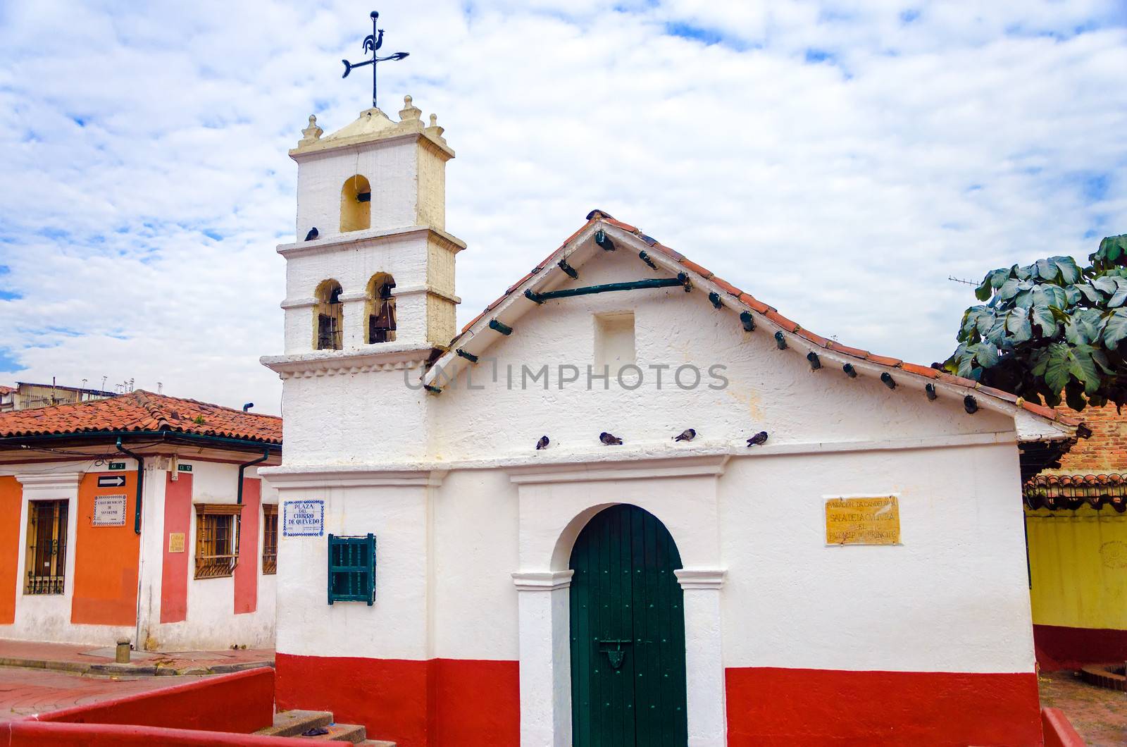 Old white historic church in La Candelaria neighborhood of Bogota, Colombia