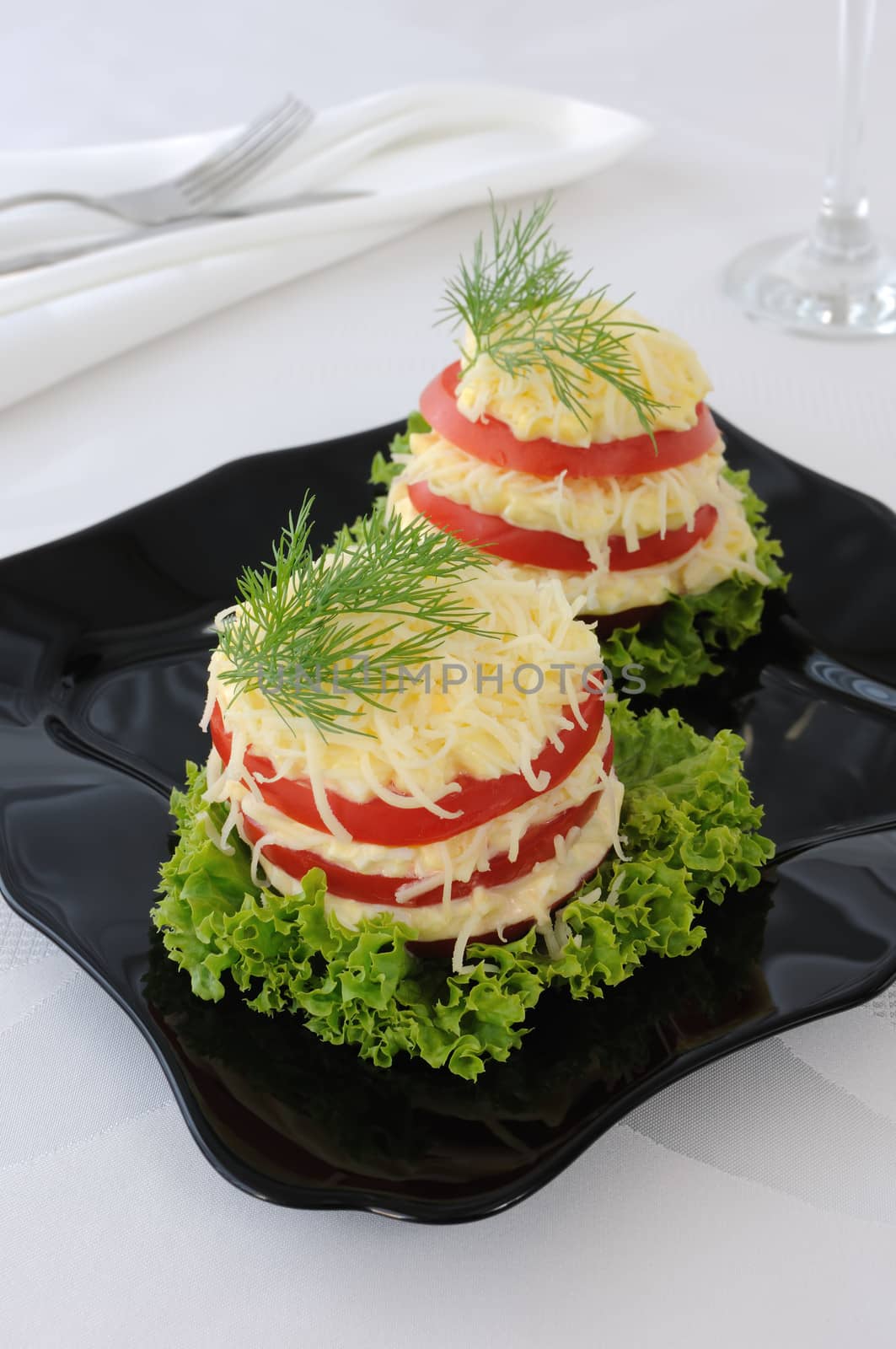 Appetizer of tomatoes stuffed with a spicy cheese and egg