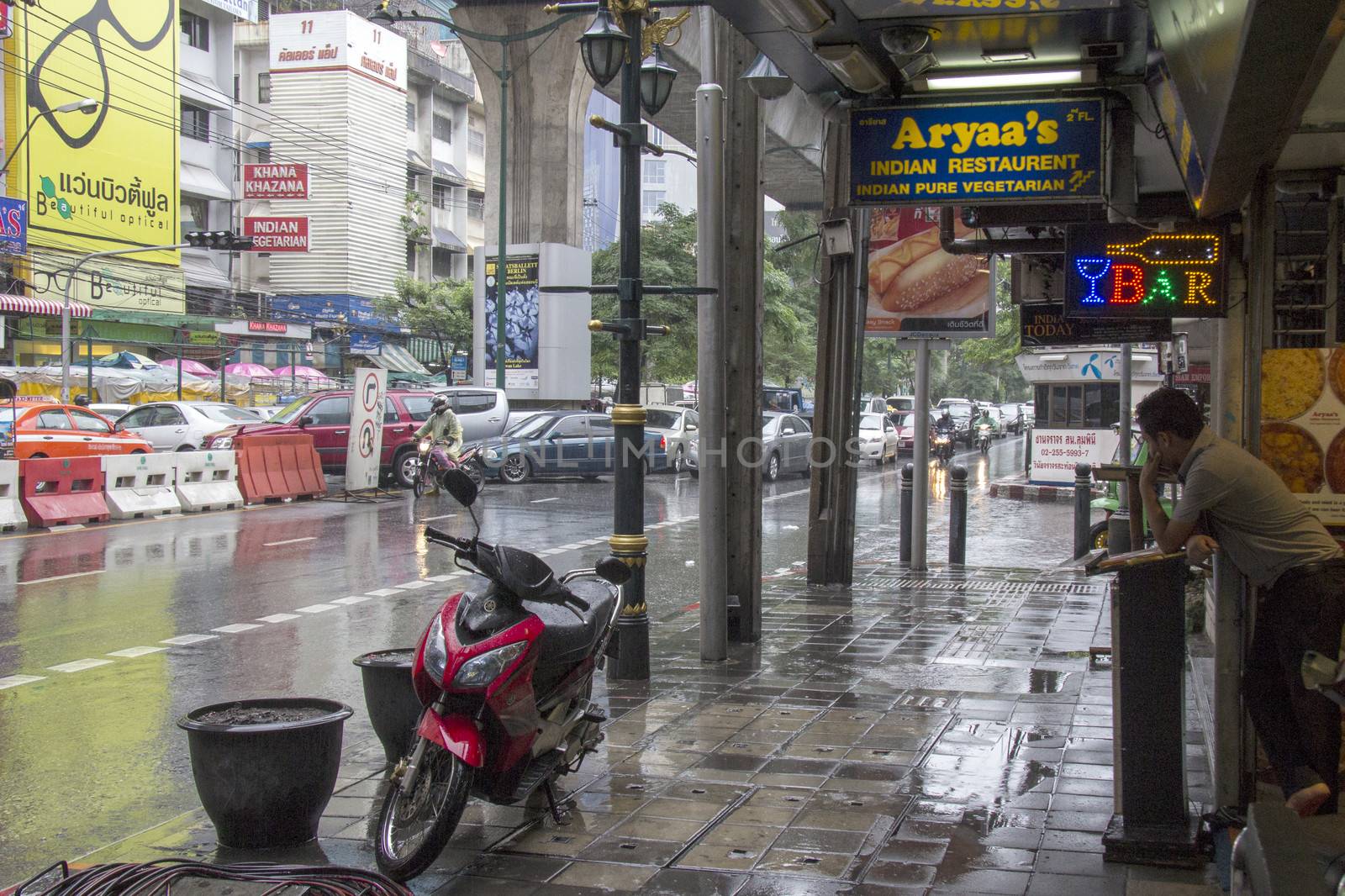 BANGKOK, THAILAND-SEPT 25TH: Sukhumvit road during a rainstorm on September 25th 2012. Sukhuvit road is at the hart f Bngkok's touist area.