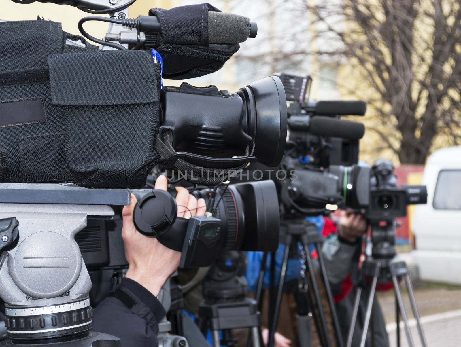 Covering an event with a video camera.