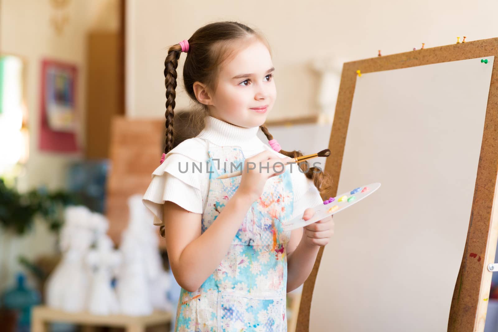 portrait of a girl standing next to his easel, a drawing lesson