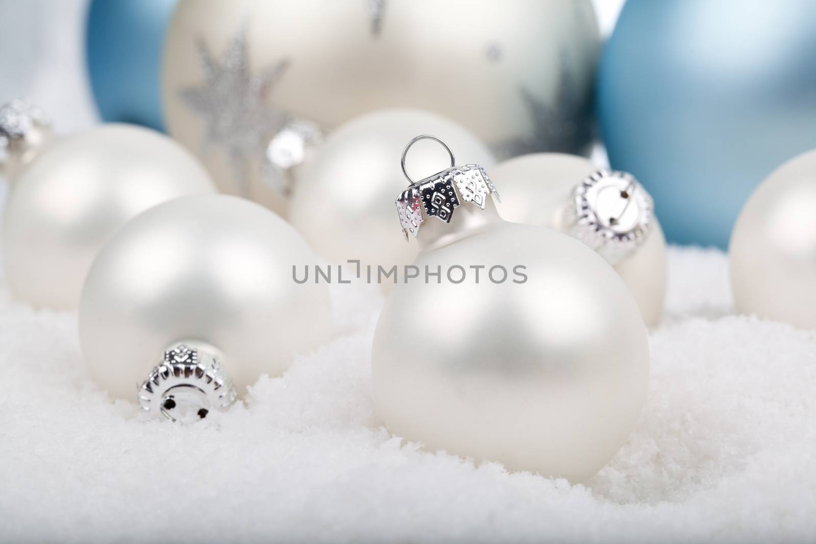 white christmas balls on snow