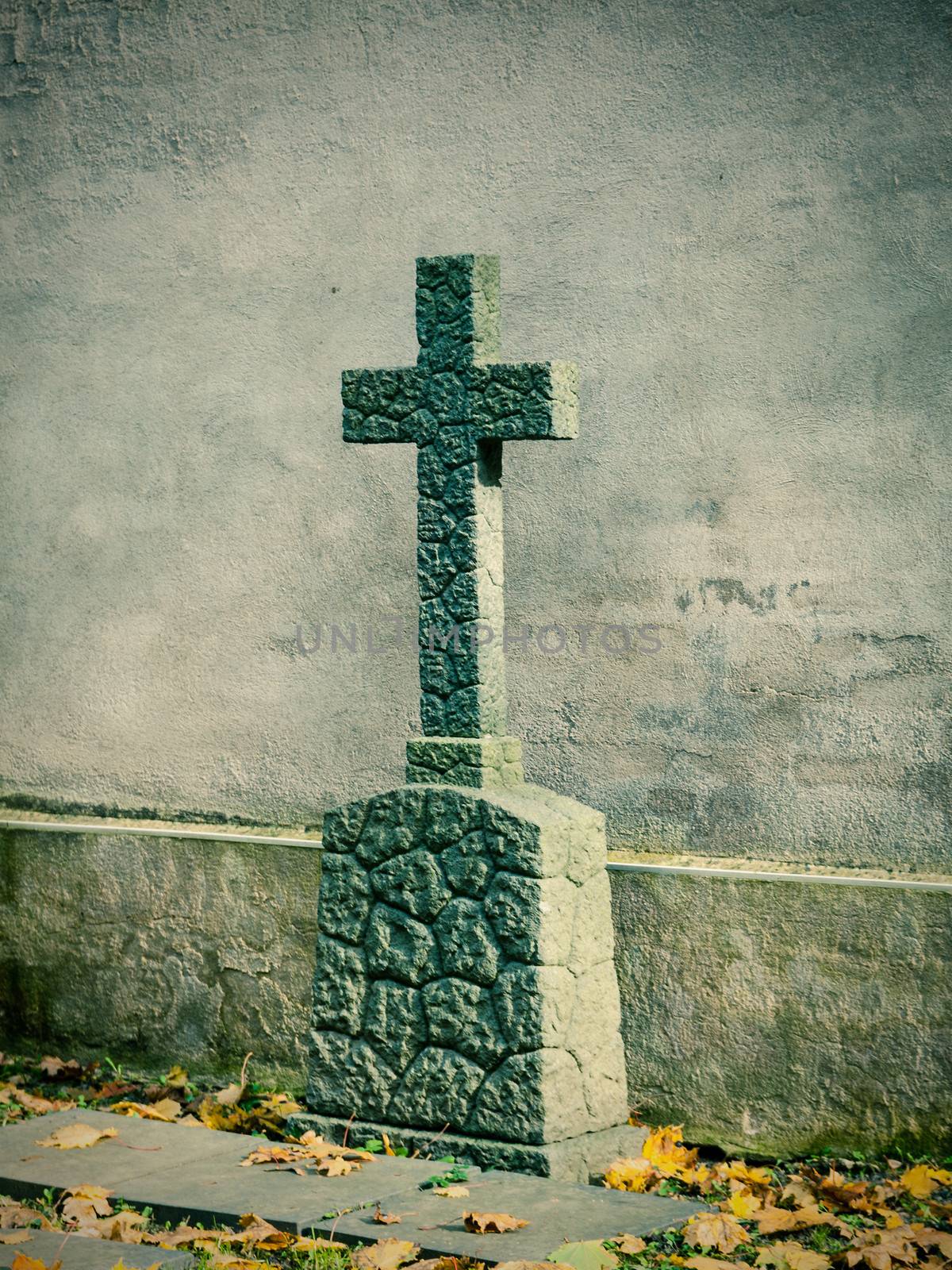 cross on tombstone grunge wall background by motorolka