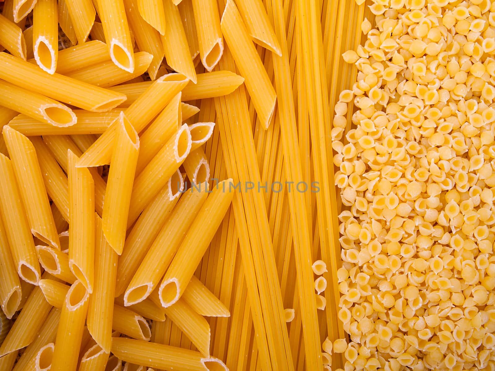 Variety of types and shapes of Italian pasta. Dry pasta background