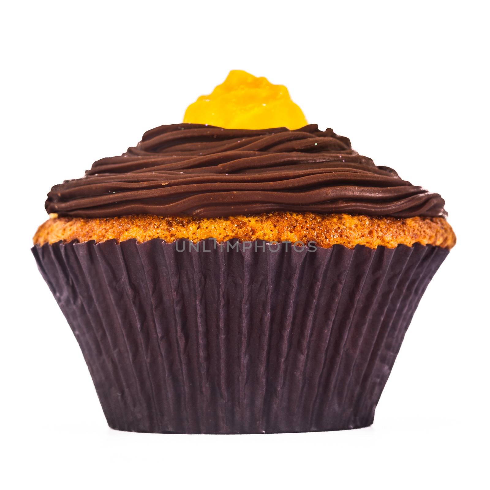 A gorgeous and delicious chocolate and carrot cupcake isolated on a white background.