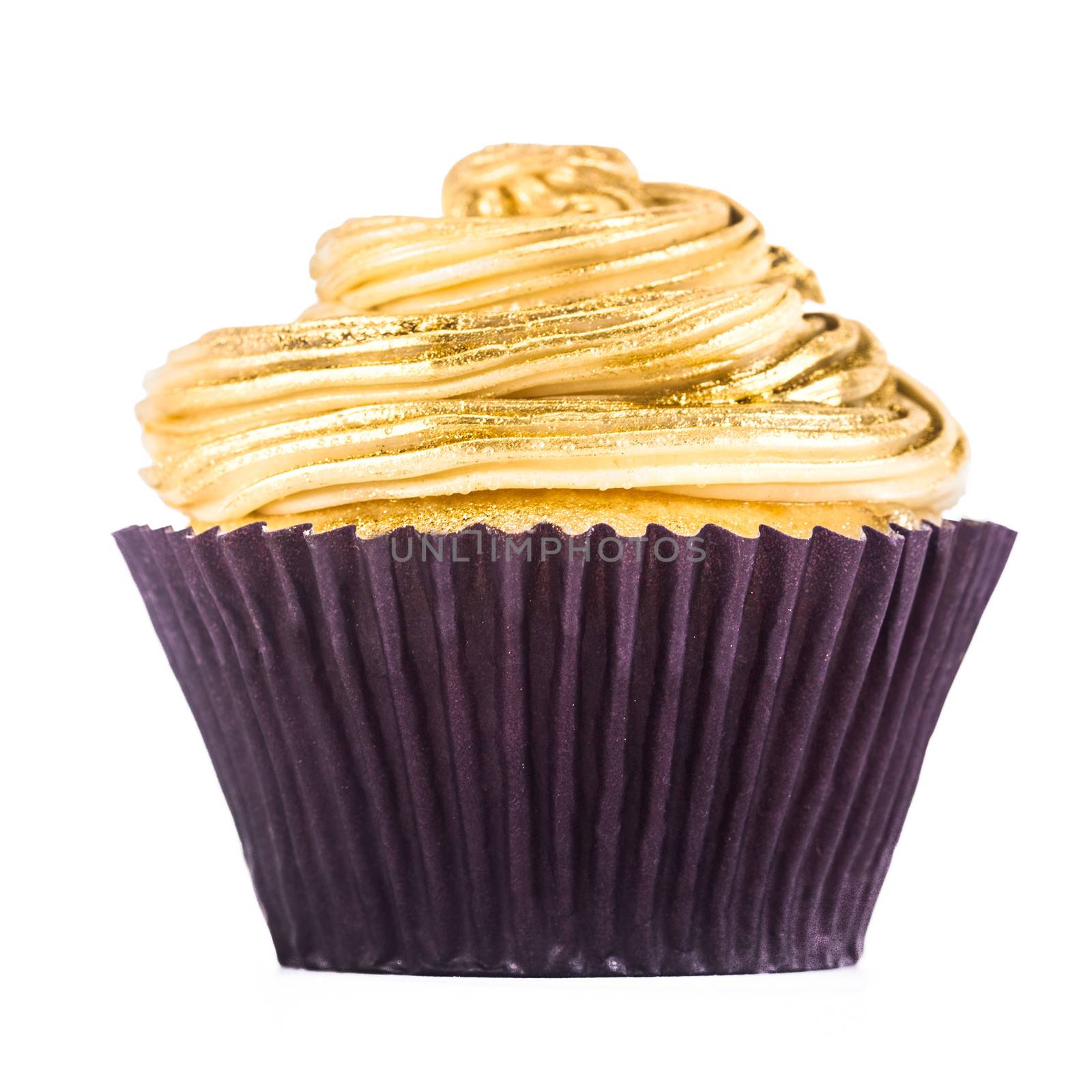 A gorgeous and delicious white chocolate cupcake isolated on a white background.