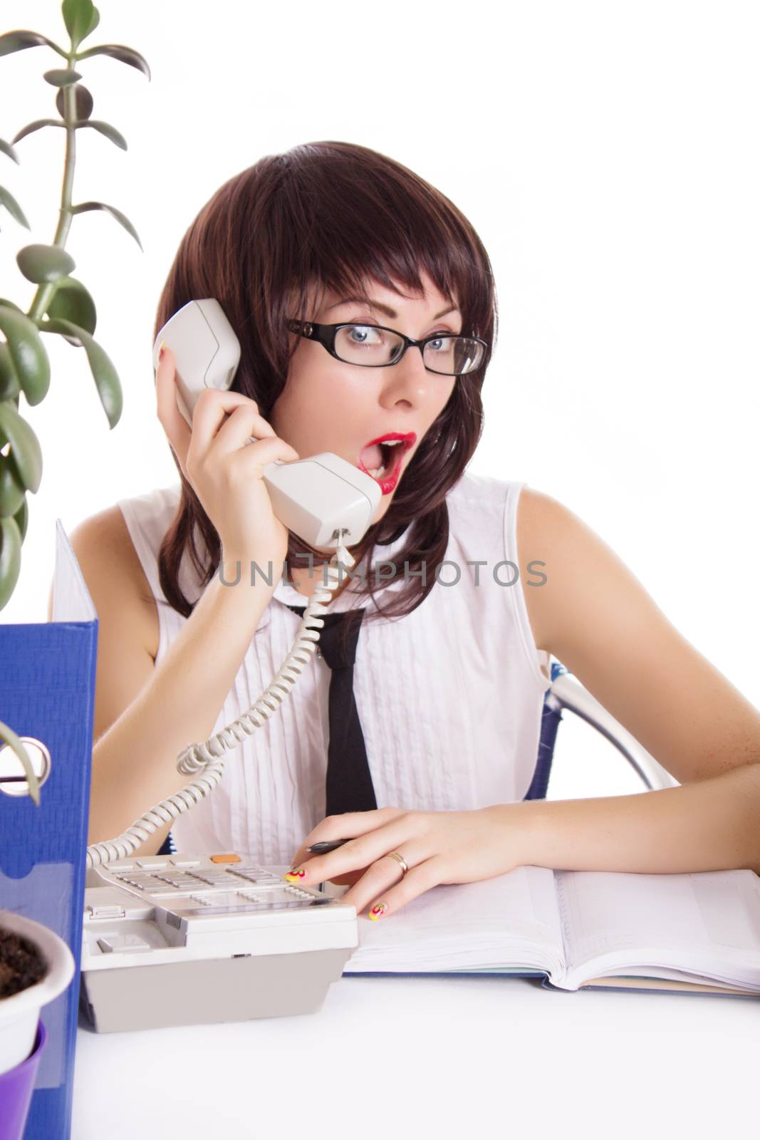 Woman assistant receiving some shocking news on phone isolated on white