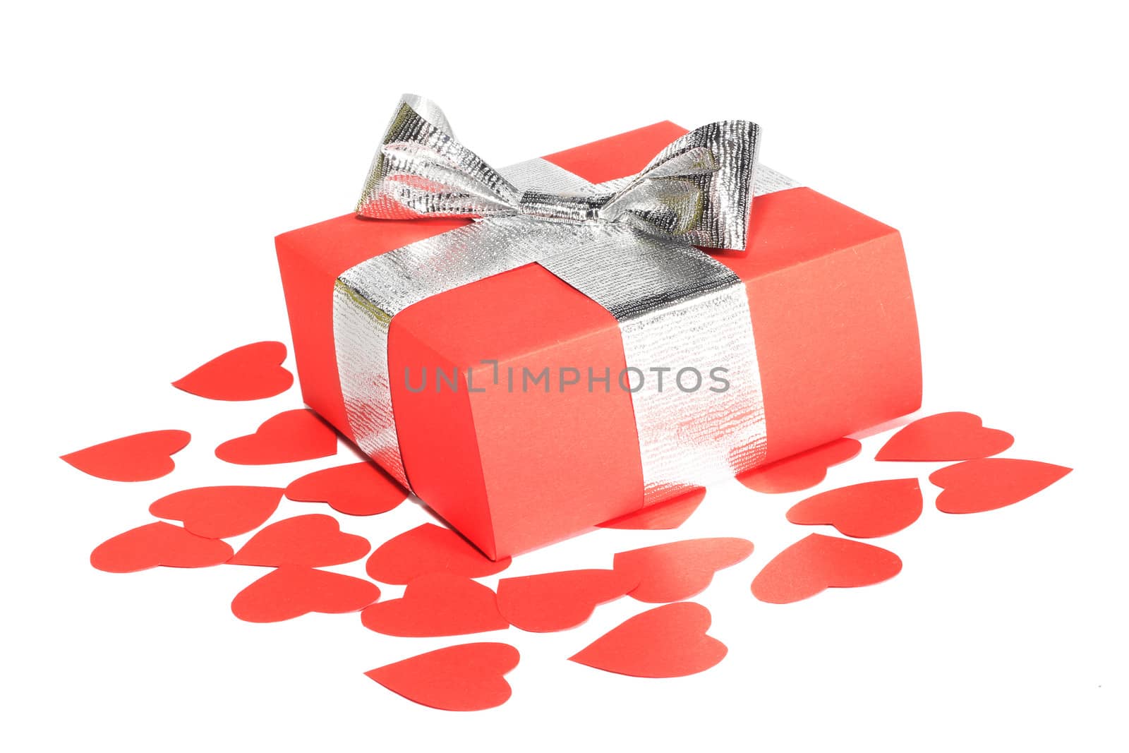 Valentines Day gift in red box and small hearts isolated on white