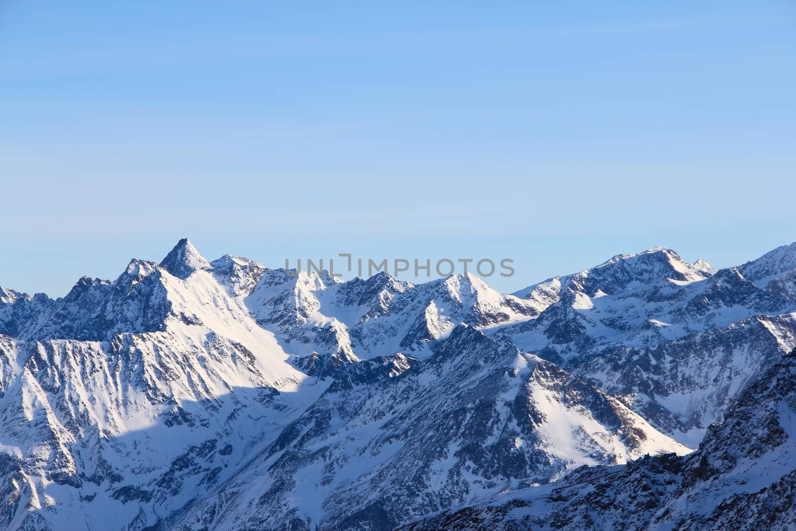 Hight mountains under blue sky beautiful winter panorama