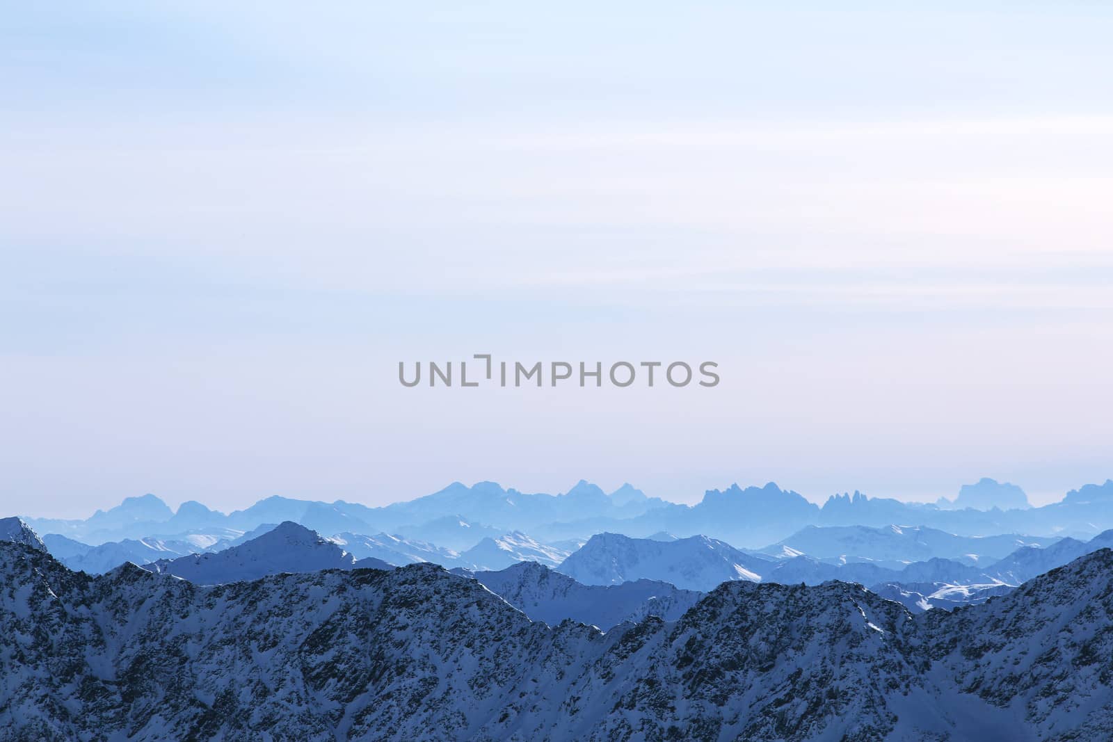 Beautiful panorama of mountain peaks in winter