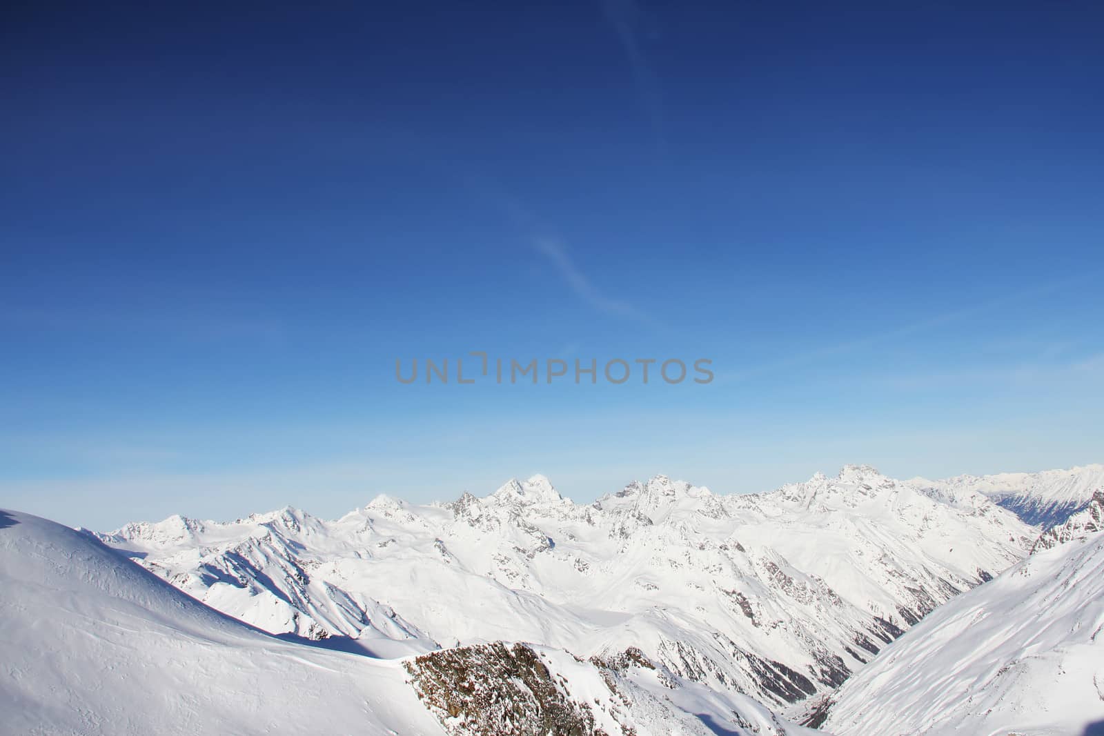 Winter alpine mountains covered with snow