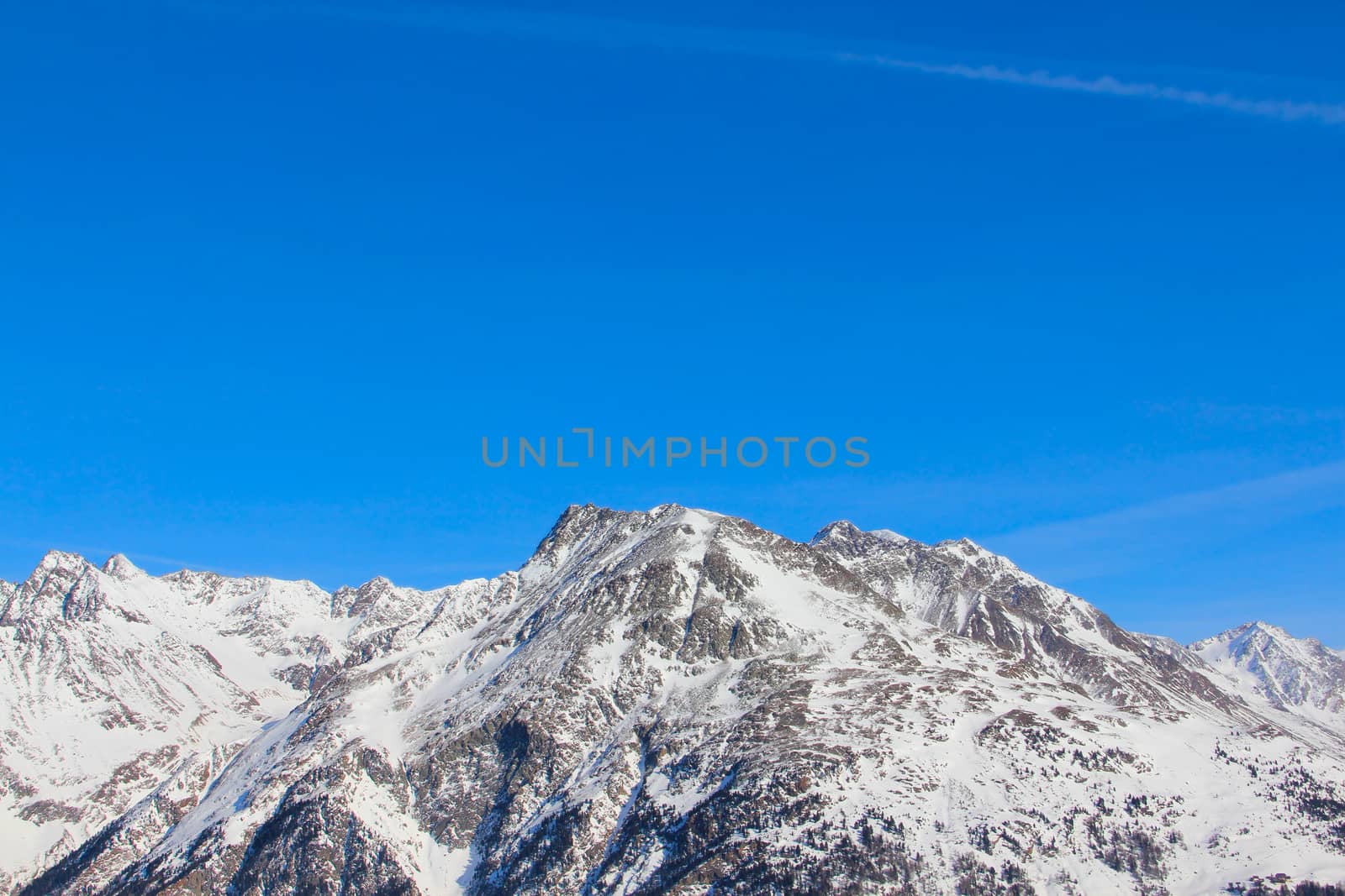 High mountains under blue sky beautiful winter panorama