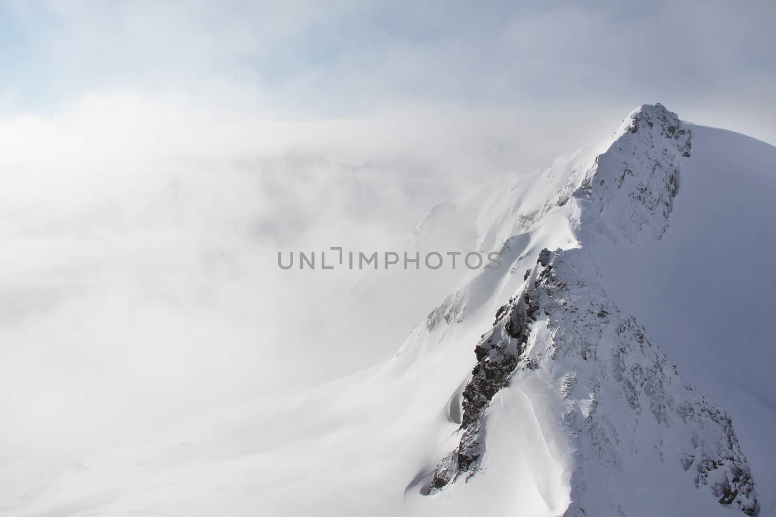 Beautiful panorama of mountain peaks in winter