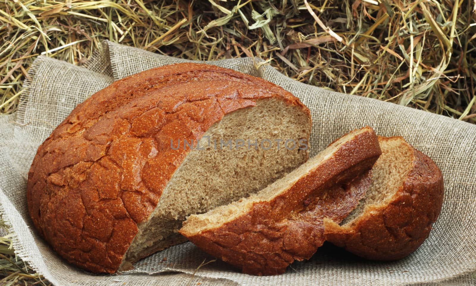 Brown sliced bread on hay by destillat