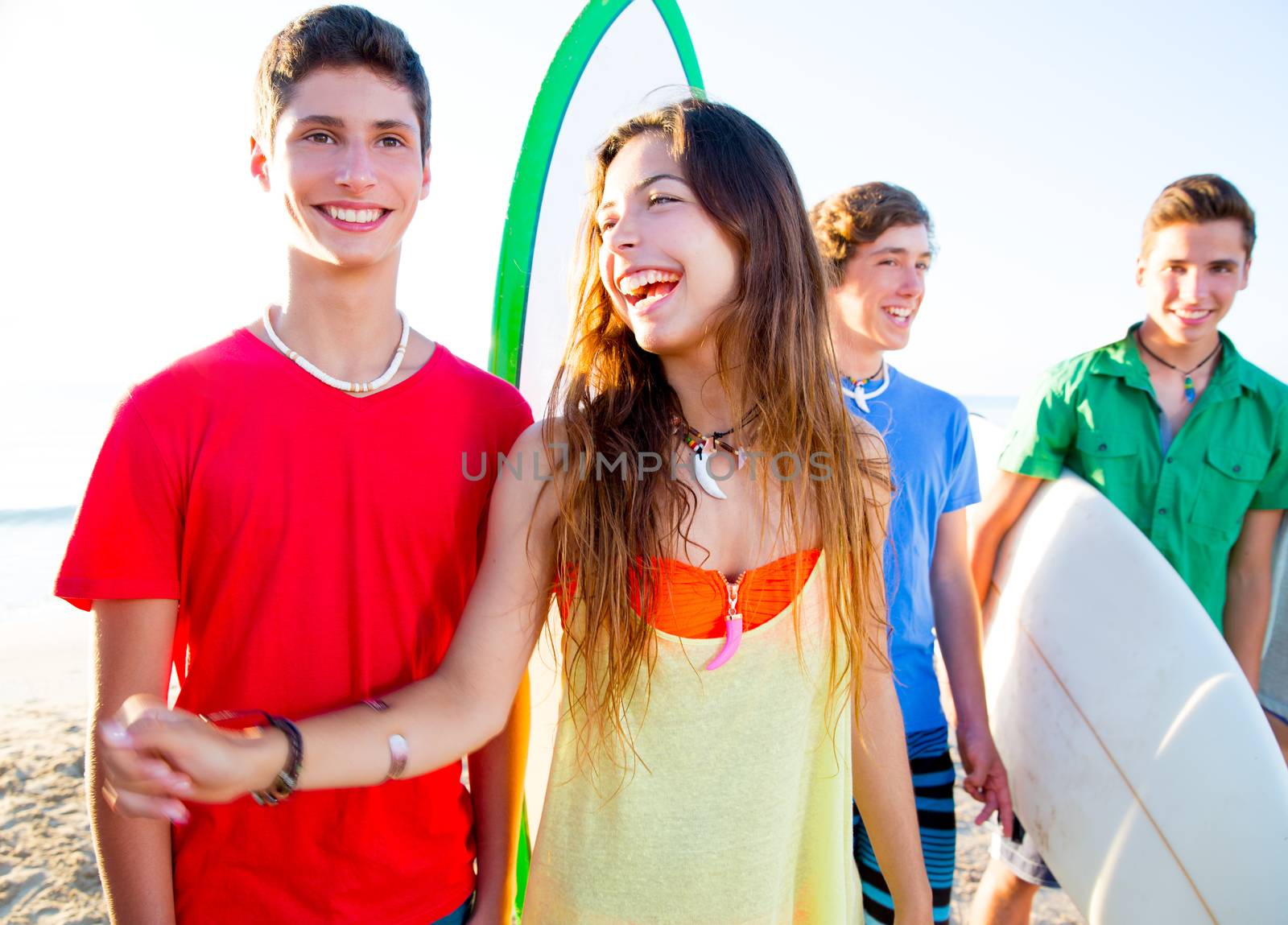 Teenager surfers boys and girls group happy in beach shore high key