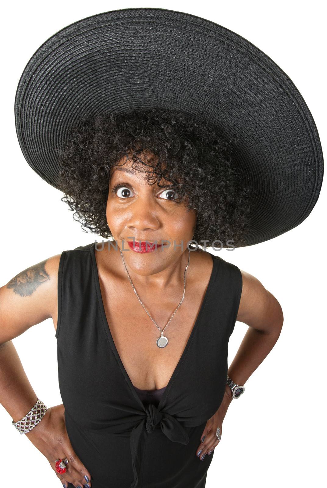 Elegant woman with hands on hips over white background
