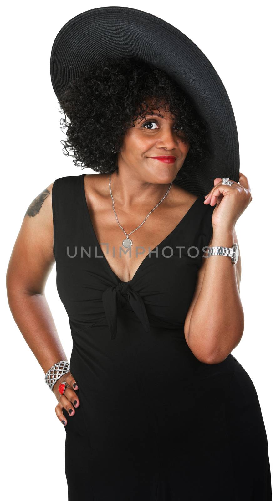 Beautiful mature African woman holding hat on isolated background