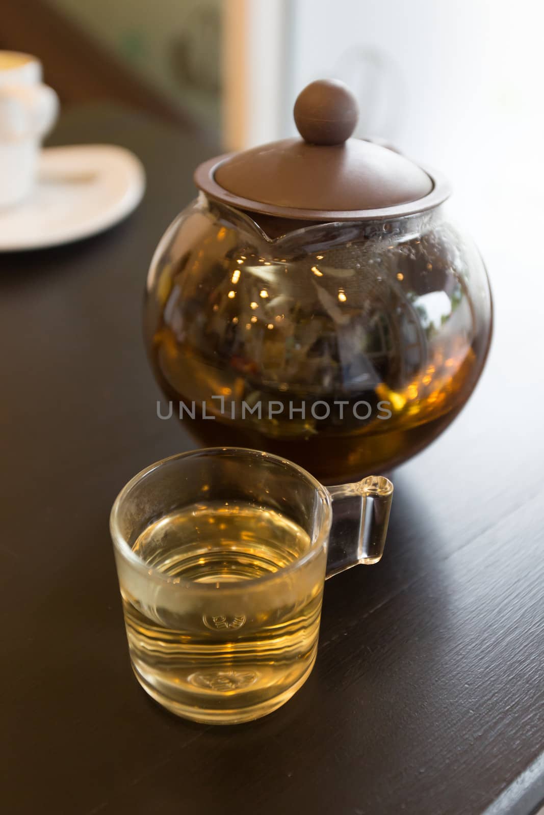 brown hot tea pot on table  by ngarare