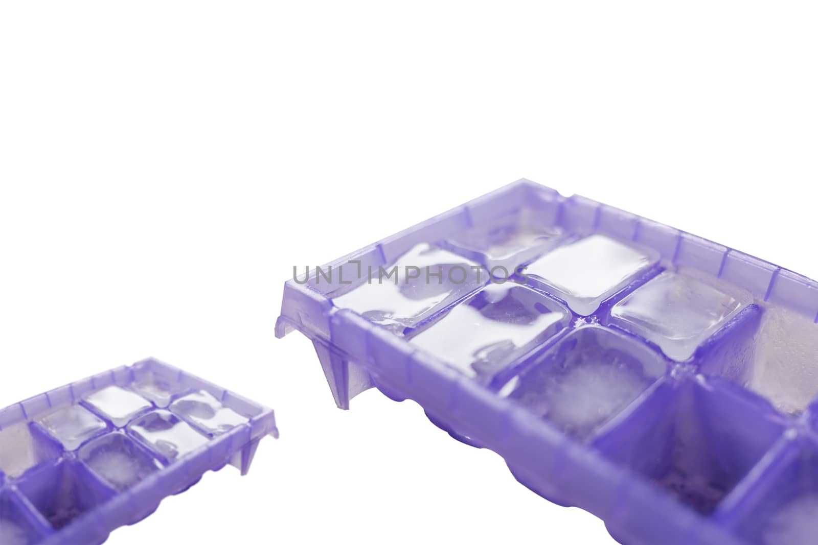ice cube in purple tray isolated on white