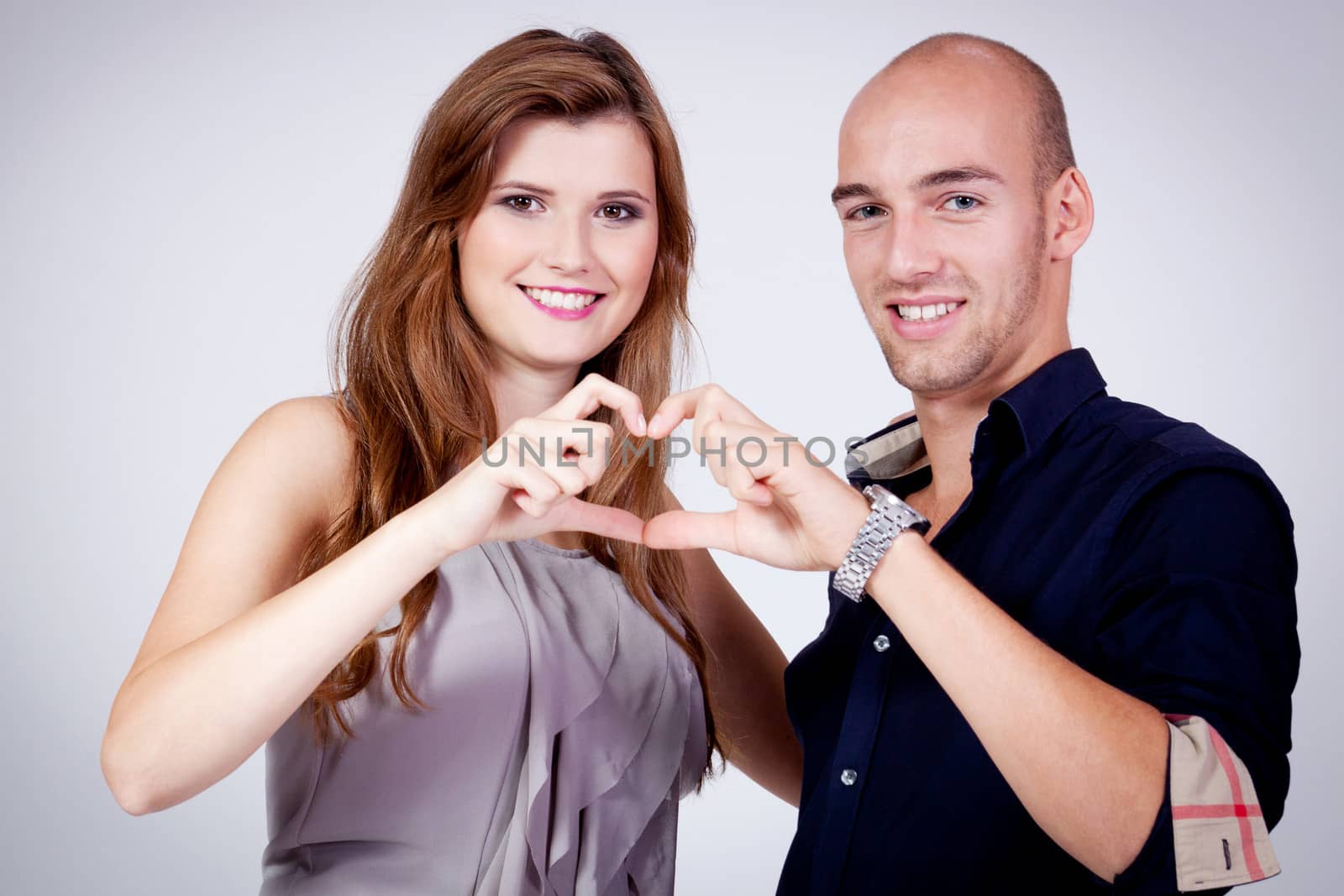 young attractive couple in love embracing portrait by juniart