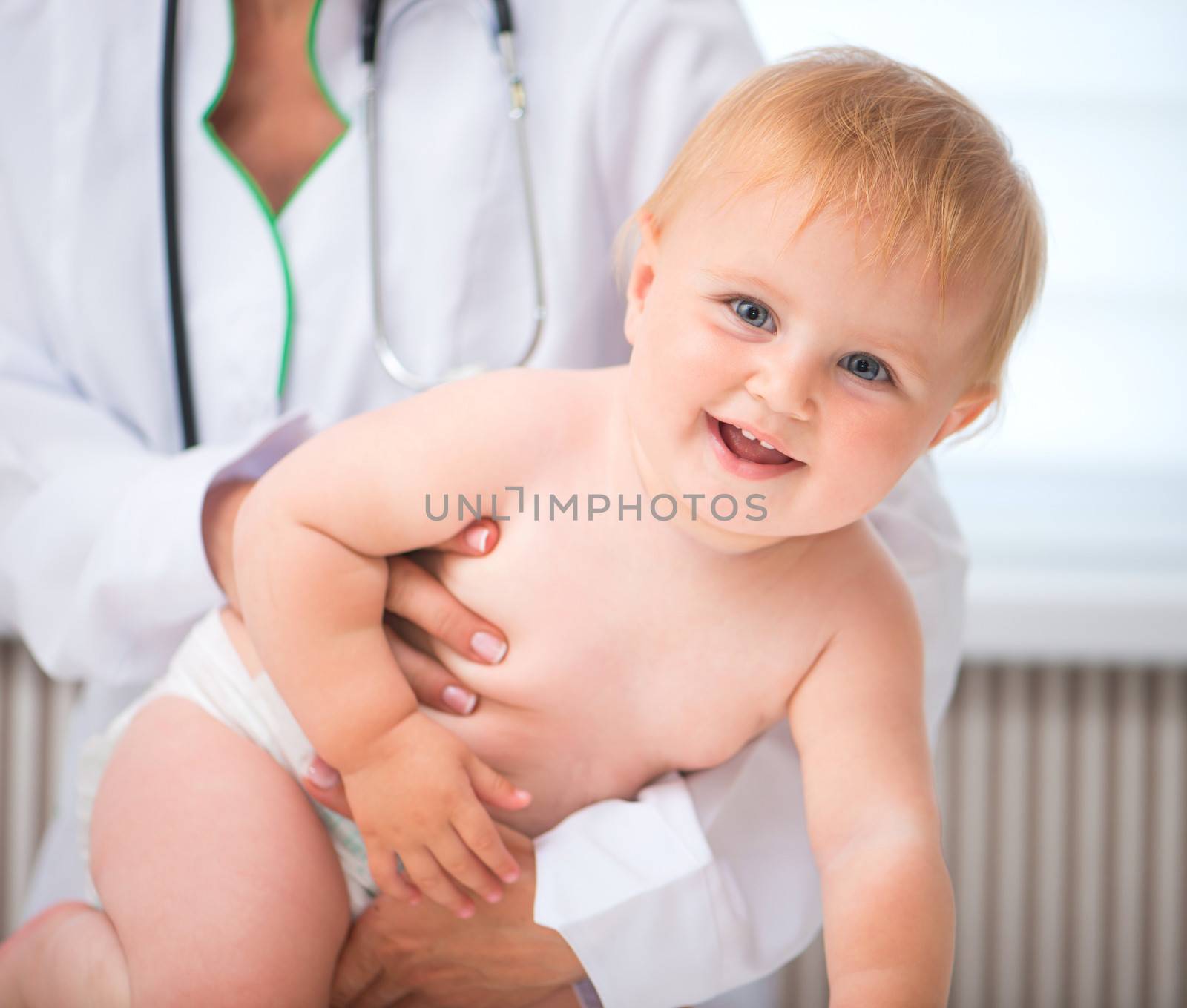 smiling baby at the doctor pediatrician