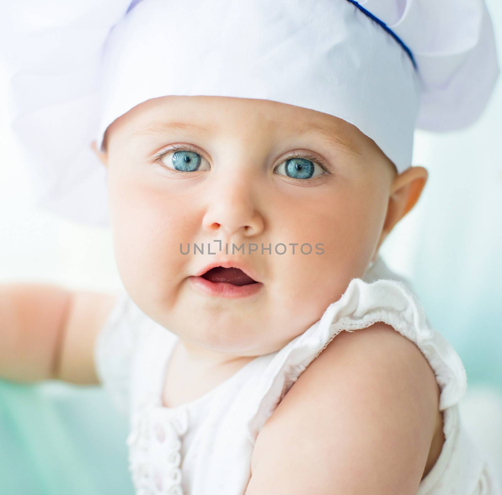 portrait of baby in chef's hat