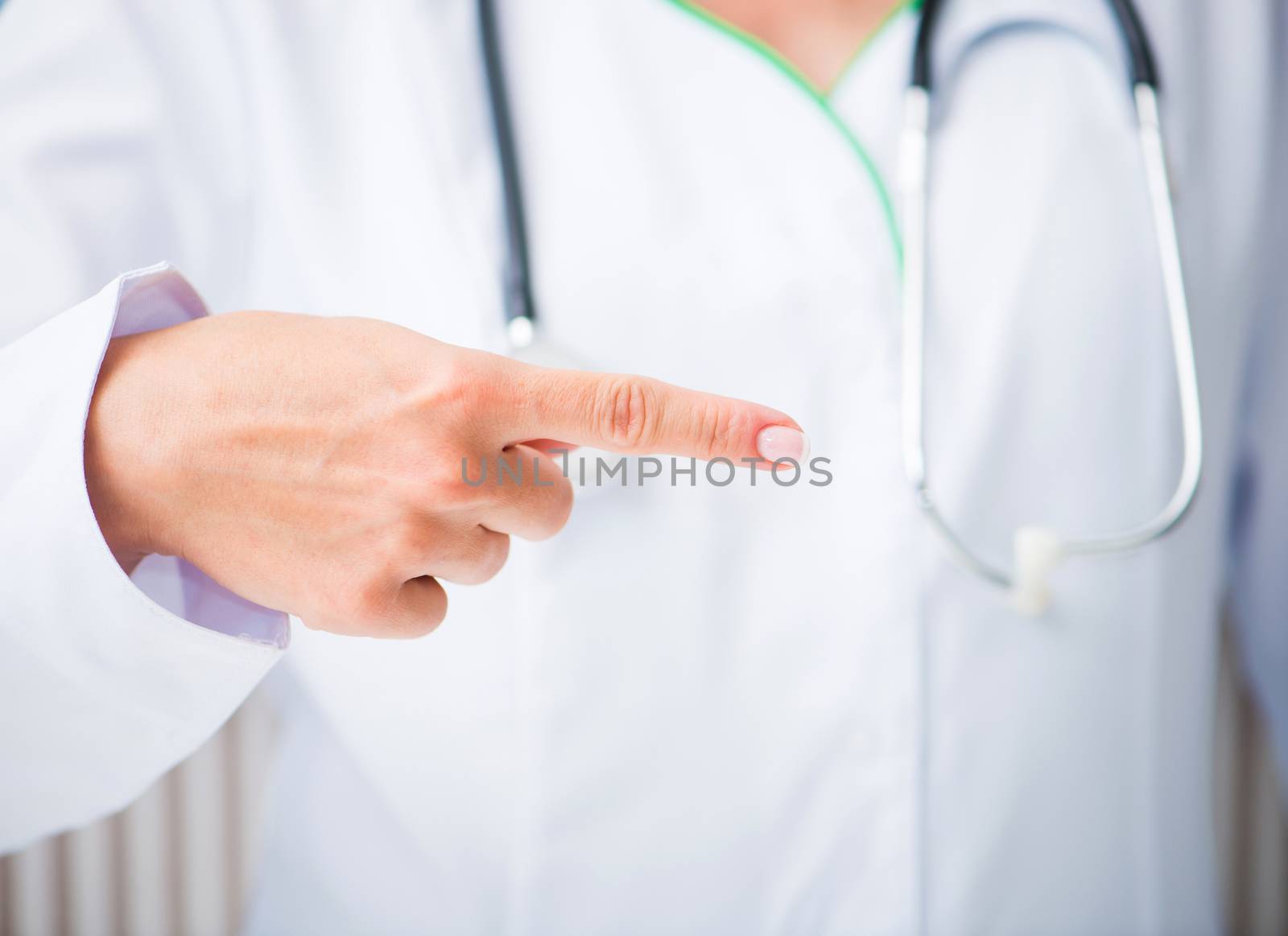 Doctor shows his index finger