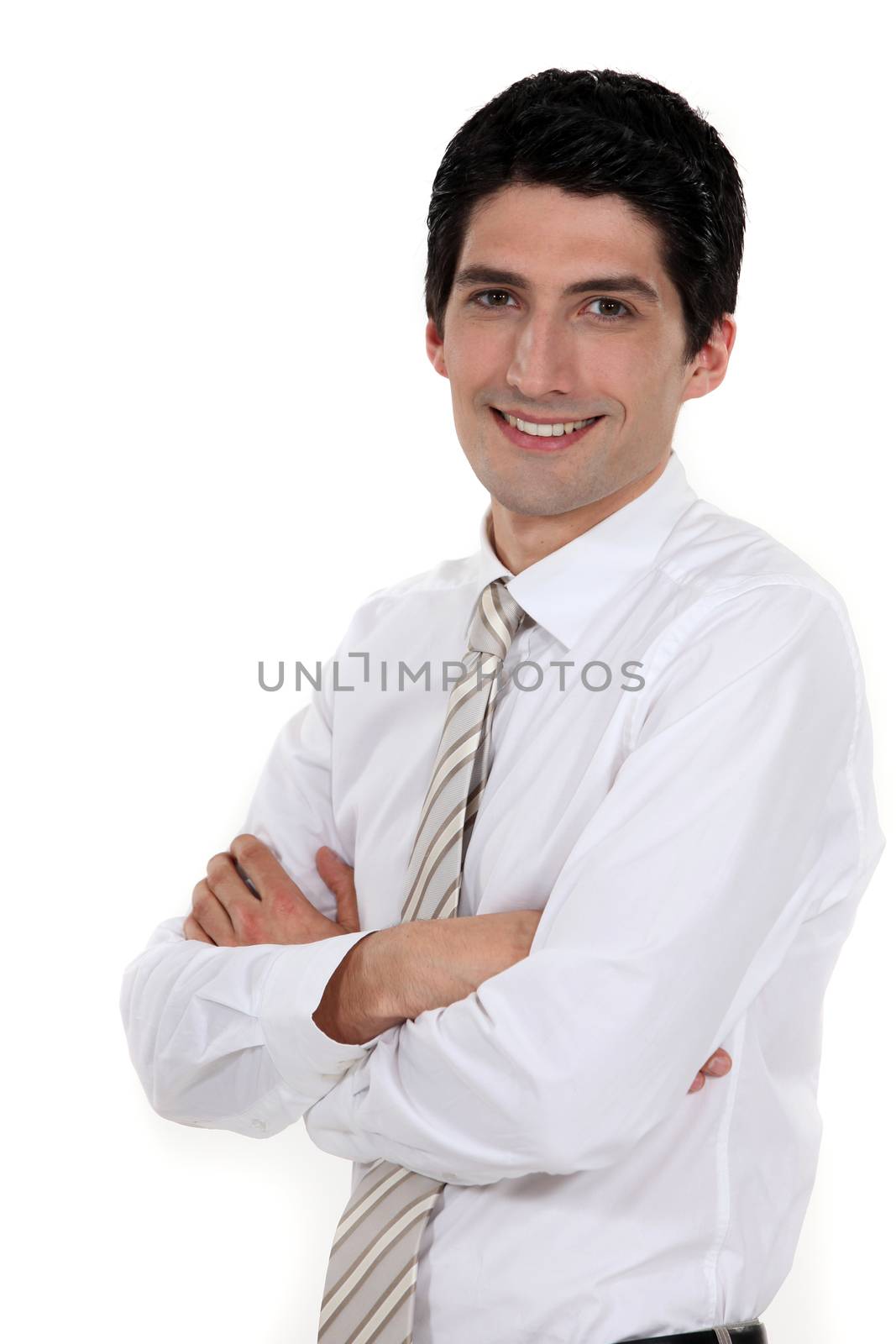 Businessman standing with his arms folded by phovoir