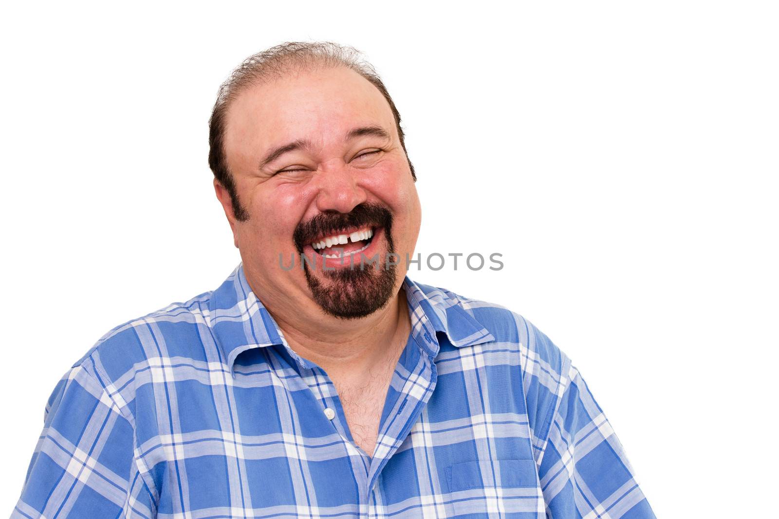 Portrait of a joyful bearded Caucasian man laughing loud, isolated on white background