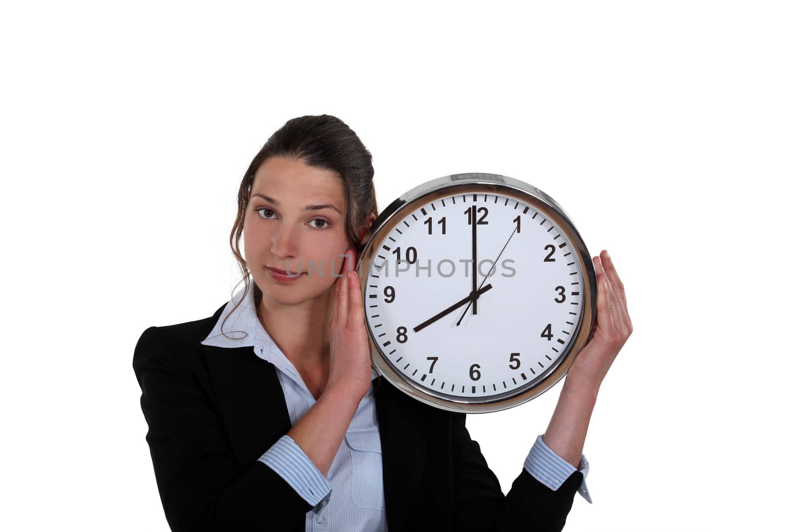 pretty businesswoman holding clock by phovoir