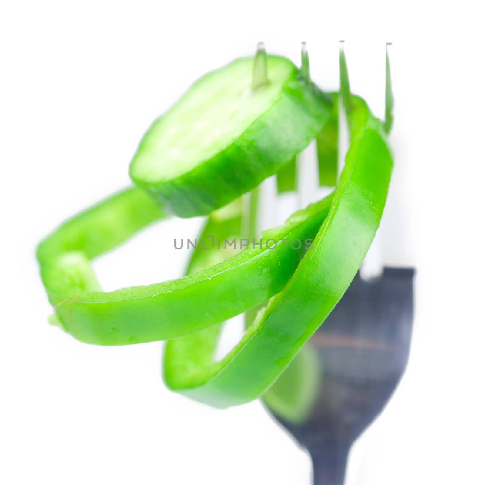 fork ,cucumber and pepper isolated on white by jannyjus