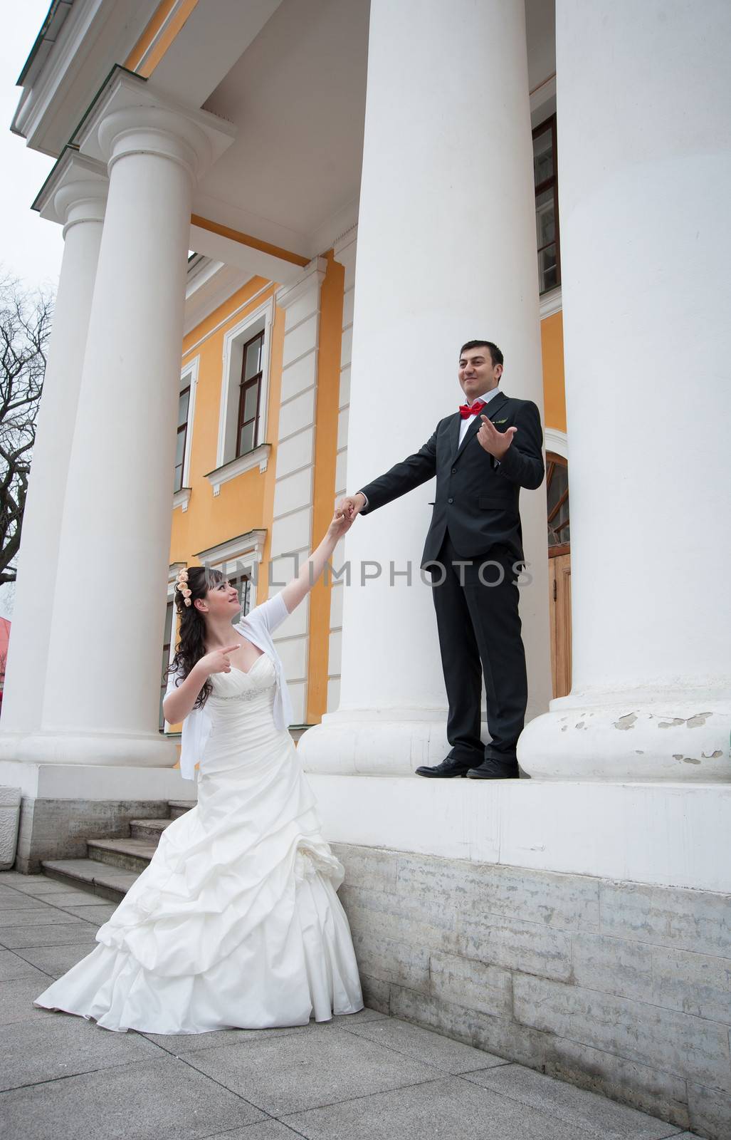 bride pulling the groom's hand