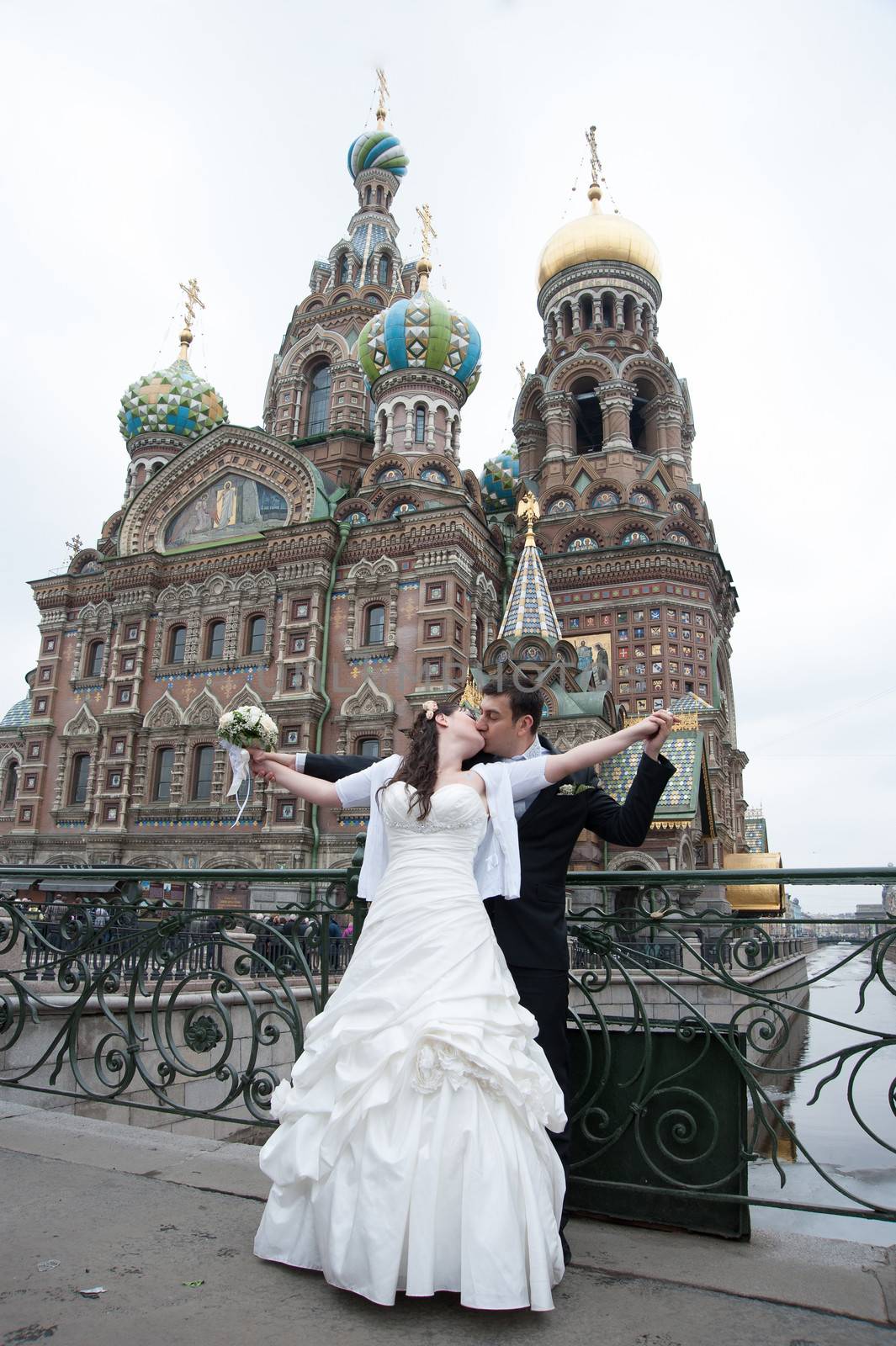 bride and groom near the temple