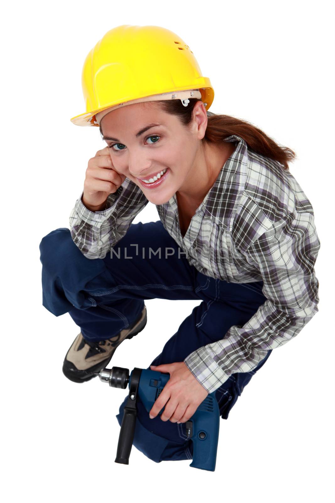 A female construction worker with a drill. by phovoir