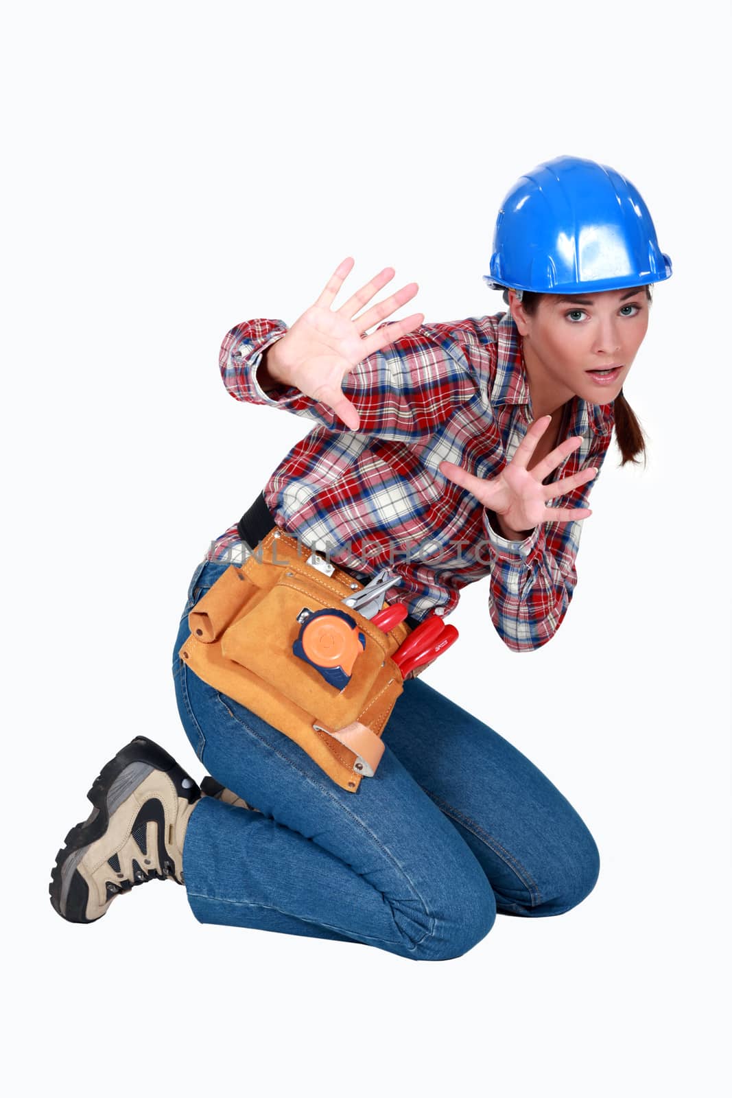 A scared female construction worker. by phovoir