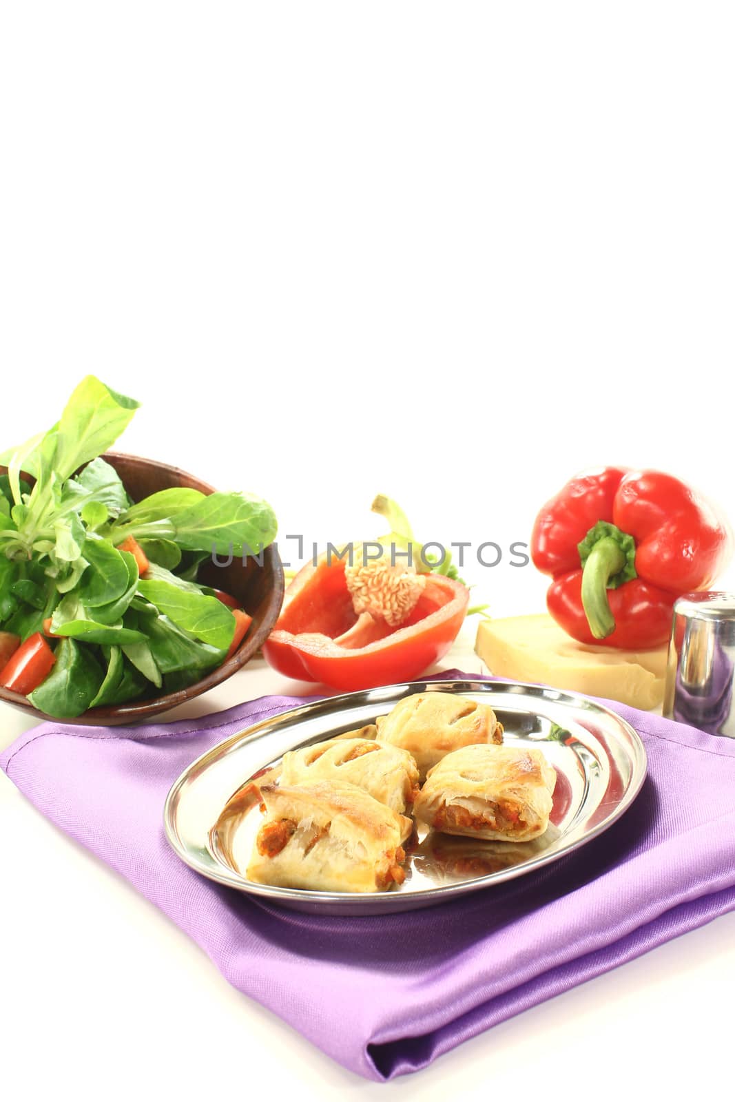 Puff pastry with bell peppers on a light background