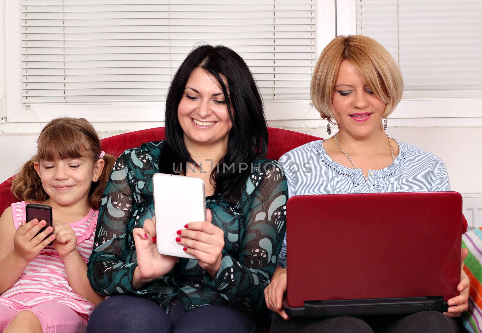 three generations girls with computers by goce