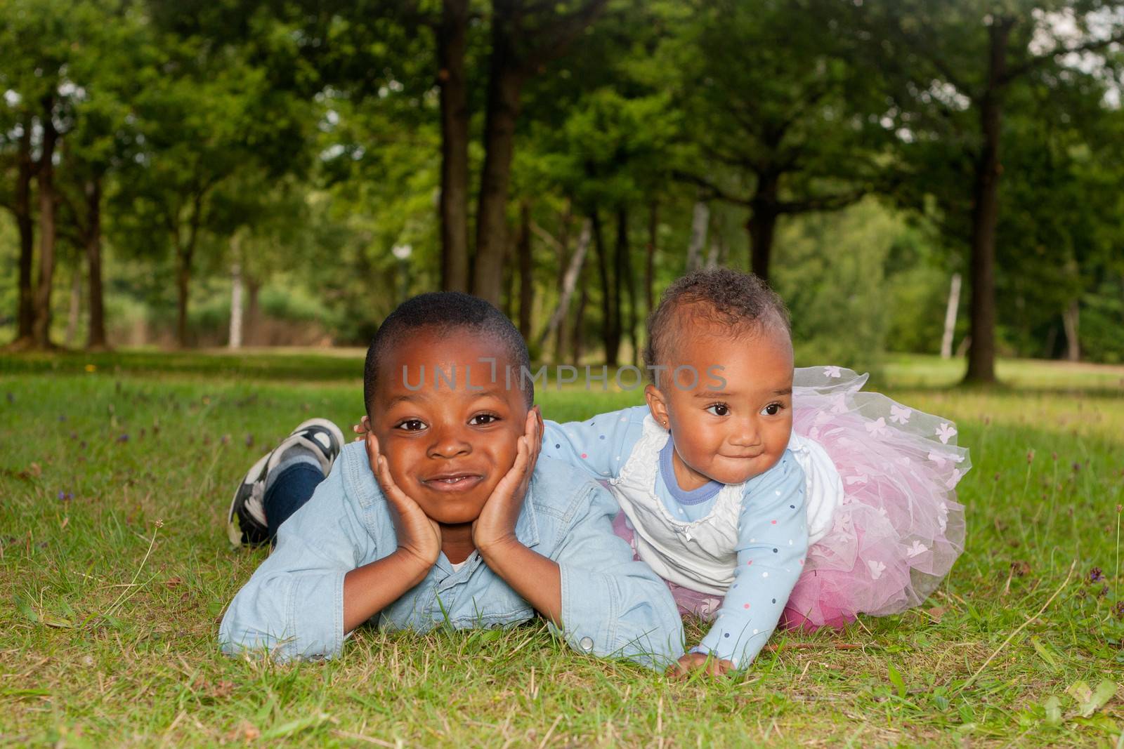 Happy little children are having a nice day in the park