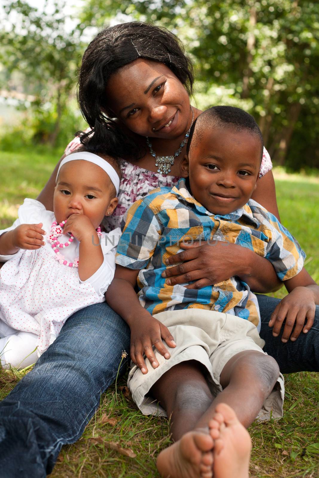 Happy mixed family is having a nice day in the park