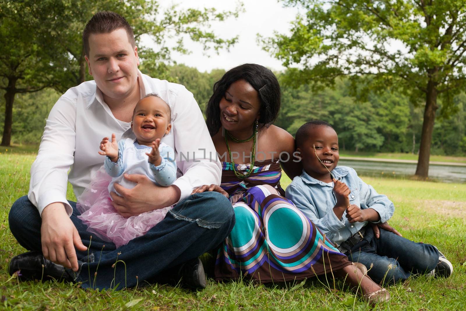 Happy mixed family is having a nice day in the park