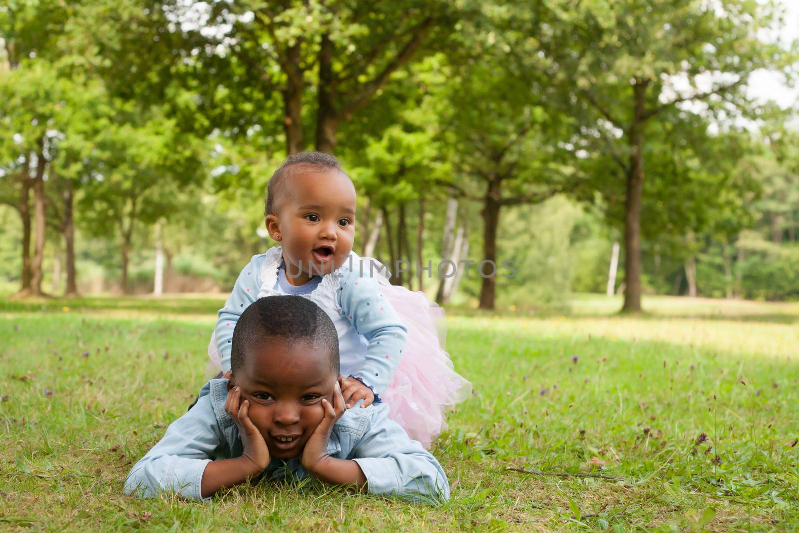 Happy little children are having a nice day in the park